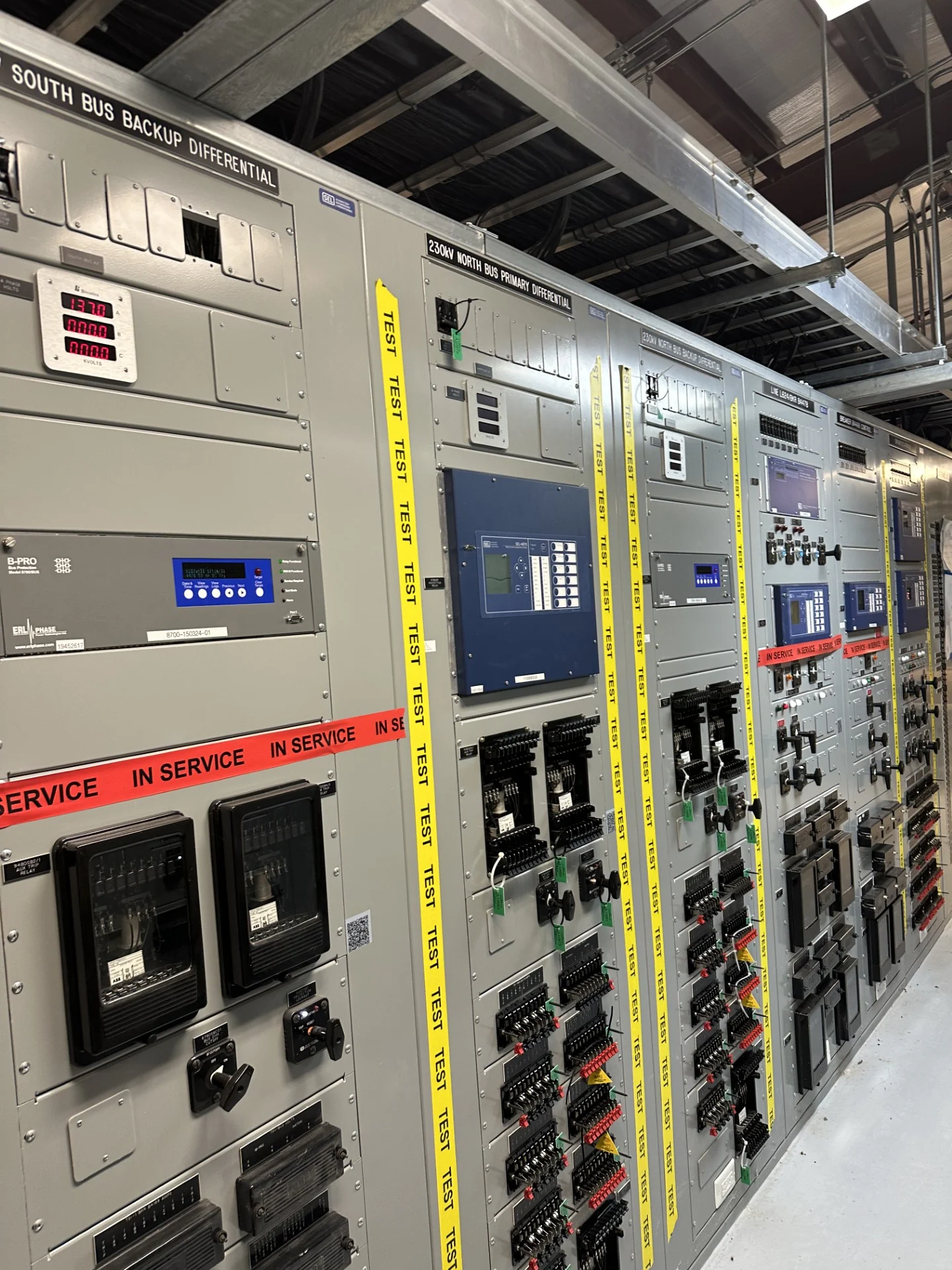 Protection panels with designated test and in-service sections.