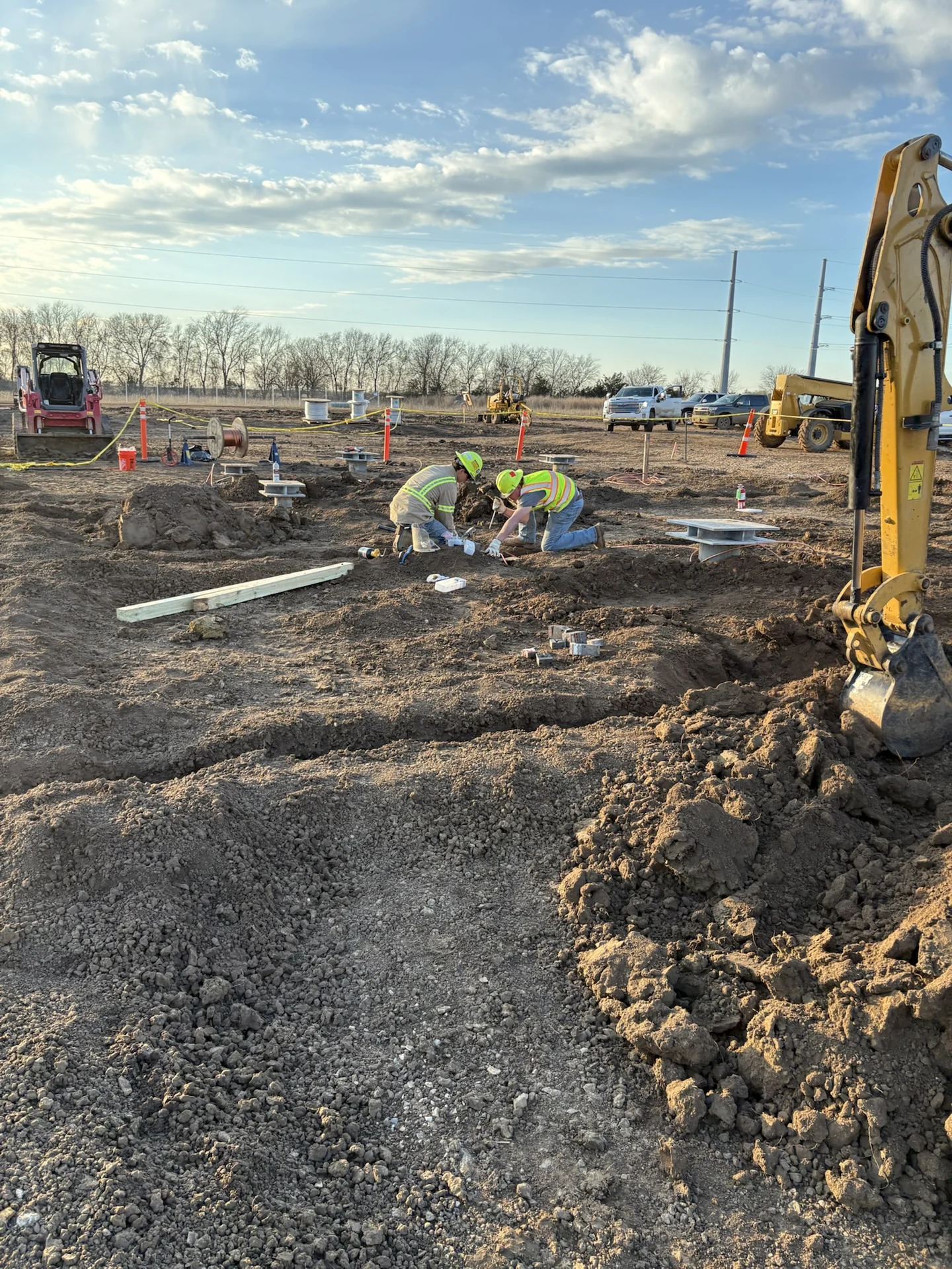 Crew installing underground conduit during construction of the Texas solar substation.